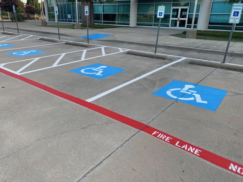 Blue ADA handicap parking symbols and access aisles